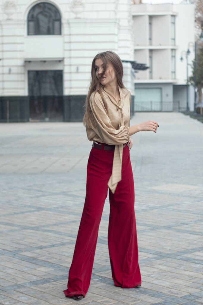 Woman in Beige Long sleeve top and wide-leg red trousers