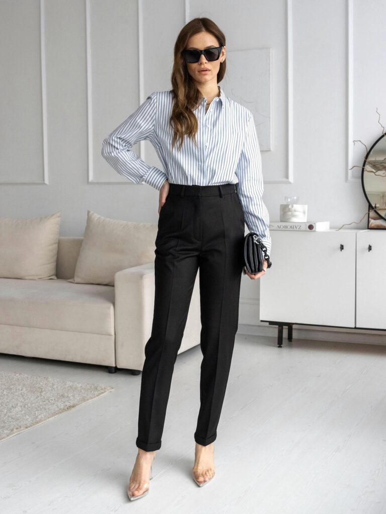 Professional pinstripe shirt and high-rise trousers styled as a base layer for a modern blazer.