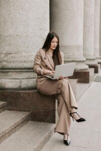 Sophisticated blazer and wide-leg trousers styled for a professional edit.