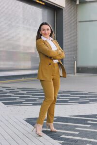 Modern tailored ochre blazer and matching trousers for a bold capsule wardrobe look.